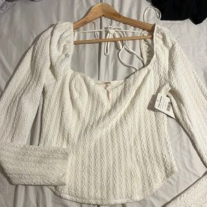 Brand new long sleeve open in the back